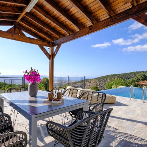 Drink in spectacular views from the poolside