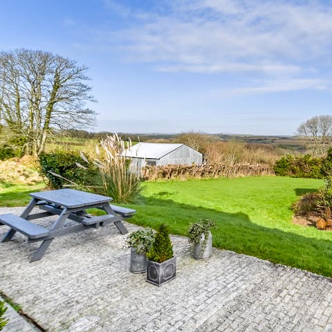 Enjoy a drink alfresco with calm countryside views