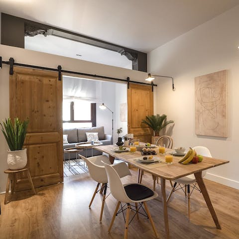 Gather round the dining table for a wholesome brunch behind the sliding wooden doors