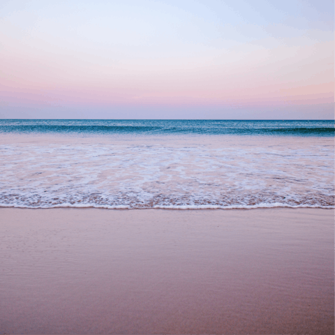 Soak up some sun at Praia da Luz's sandy beach, just a few steps from your front door