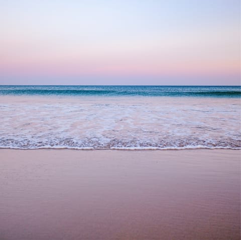 Soak up some sun at Praia da Luz's sandy beach, just a few steps from your front door