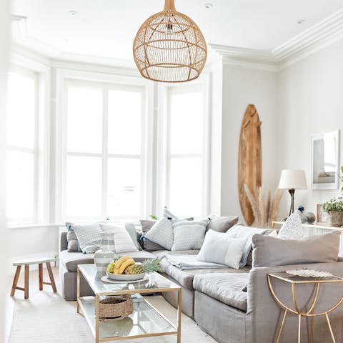 Relax in the living room bathed in natural light from the bay window