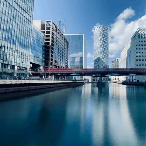 Wander around Canary Wharf, dwarfed by the stunning skyscrapers