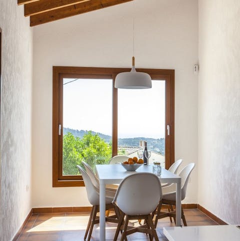 Enjoy a home-cooked dinner inside on cooler evenings, admiring the view from the large window