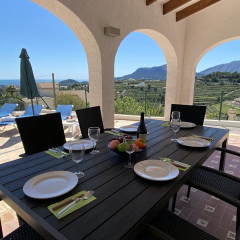 Gather around the outdoor dining table for relaxed barbecue dinners, watching the fiery sun go down around you