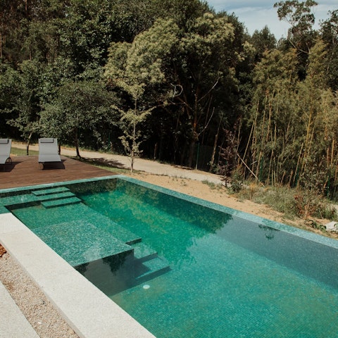 Cool off in the infinity pool amid lush gardens