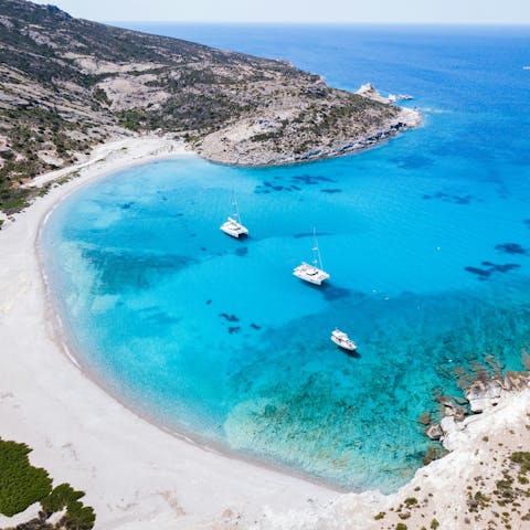 Discover one of Milos' many turquoise-water beaches
