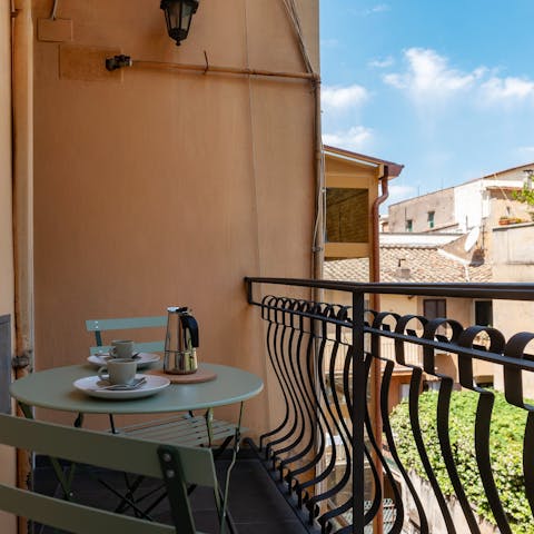 Wake up to coffee on the balcony before a busy day
