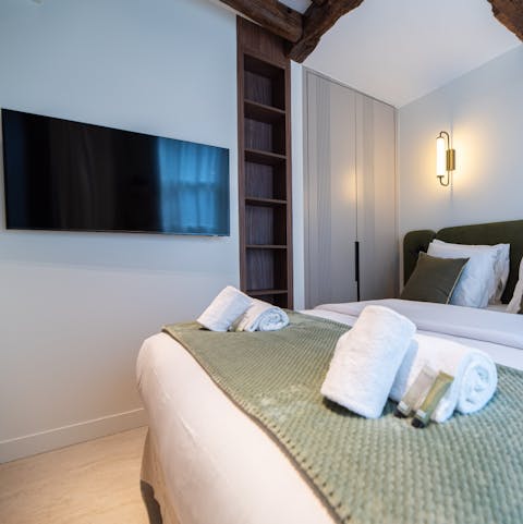 Sink into the bed and put on a good movie after a long day of sightseeing