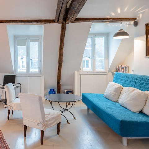 Enjoy the cosy charm of your living room, perfect for evenings of French wine and movies