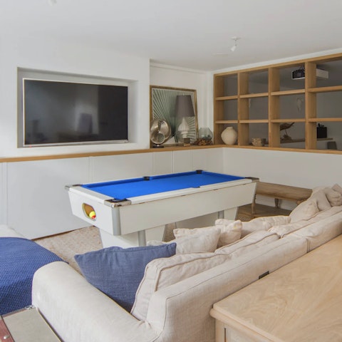 Challenge all comers to a game of pool in the games room/lounge