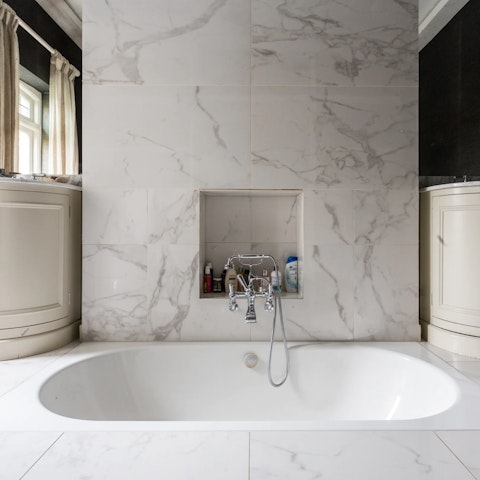 Soak away your cares in the stunning sunken bathtub