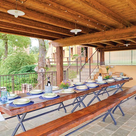 Dine, country-style, at the long wooden table outside