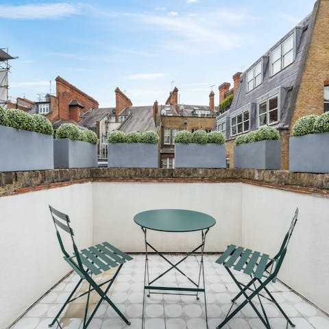 Enjoy a glass of wine in the sun of  the small balcony
