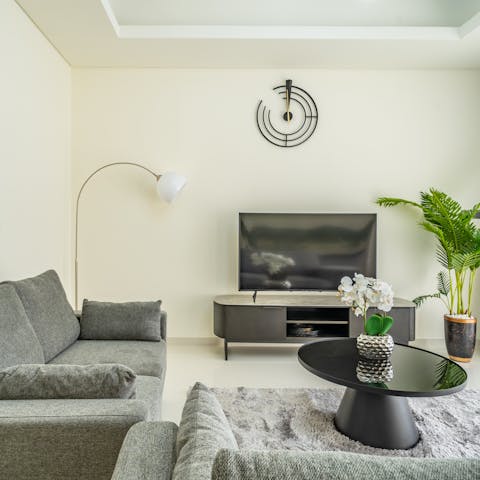 Unwind together in the plush living room with a movie