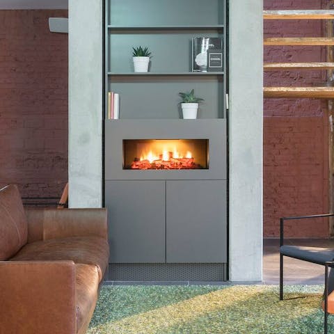 Warm up by the feature fireplace