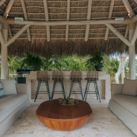 Unwind in the private palapa, glass in hand