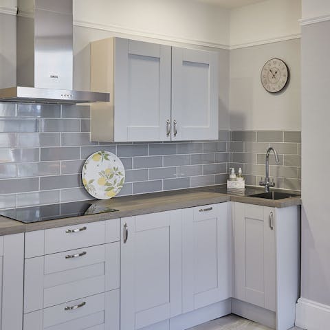 Prepare tasty homecooked meals for your loved ones in the sleek kitchen