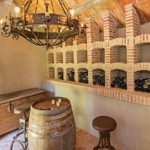 Enjoy a tipple of aged Spanish wine in the wine cellar