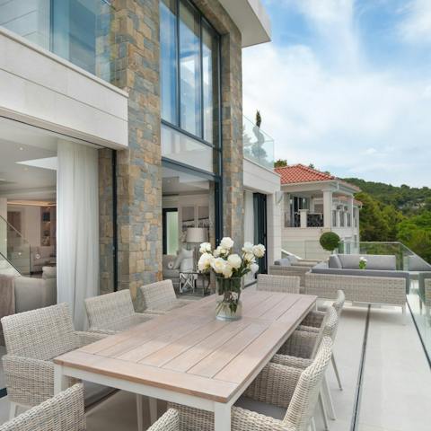 Dine alfresco on the outdoor table with some authentic Croatian dishes