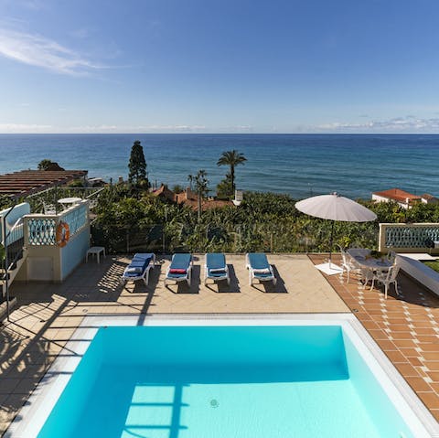 Admire the sea views from the pool