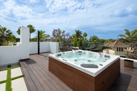Soak in the rooftop hot tub after a meal on the terrace