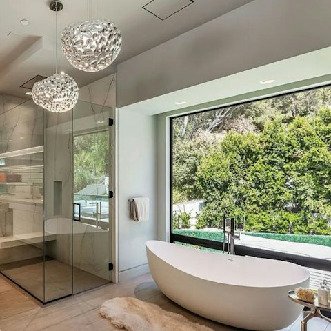 Soak in the tub and soak up the views