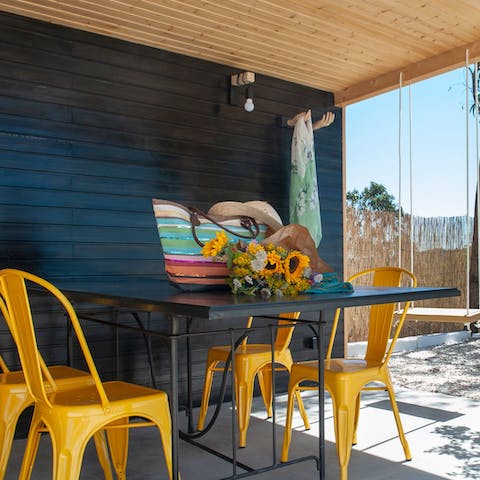 Eat outdoors in the shade of the stylish shelter