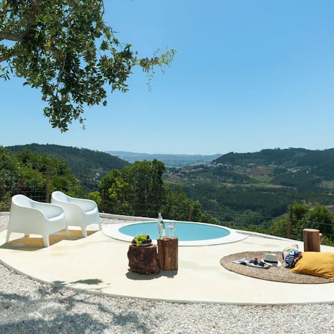 Look down from your hilltop retreat as you dip you feet into your little pool