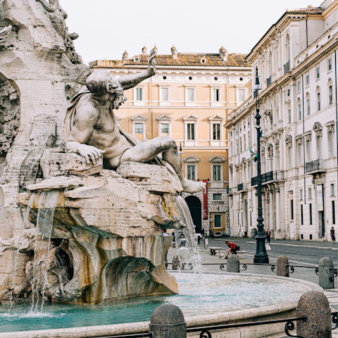 Visit the iconic three fountains at Piazza Navona, a must-see in Rome