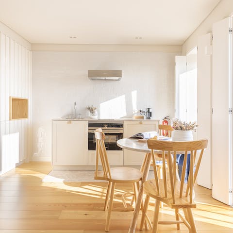 Start mornings with fresh coffee and locally bought pastéis de nata at the window-side table