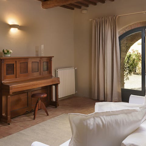 Play a tune on the piano in the lounge