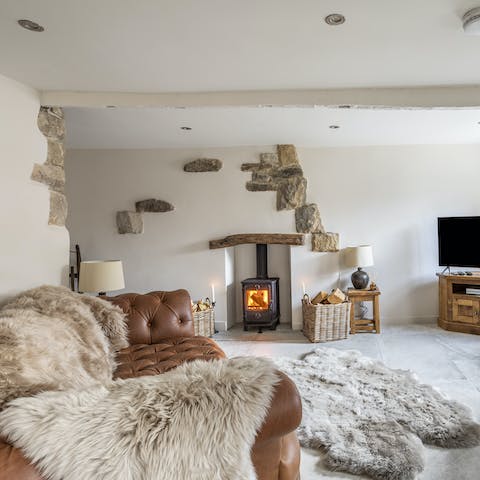 Cosy up in a firelit living space, ideal for slow mornings