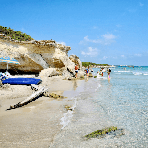 Sink your feet into the sandy beach of Torre San Giovanni, just 18km from the villa