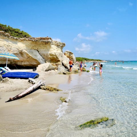 Sink your feet into the sandy beach of Torre San Giovanni, just 18km from the villa