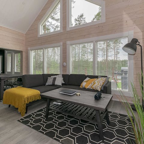 Curl up in front of the fire in the chic Nordic living room