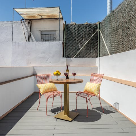 Enjoy a glass of Spanish wine on the terrace at sunset