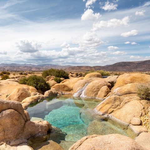 Admire the scenery from the rock-carved plunge pool