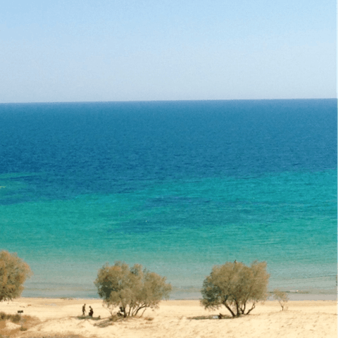 Spend the day on beautiful Lakkos Beach, just ten minutes on foot