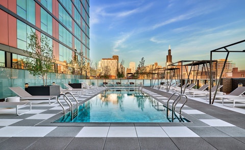 Swim in the communal pool as the Chicago skyline glows at sunset