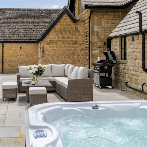 Relax in the hot tub while the barbecue sizzles