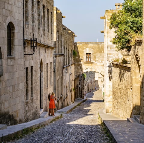 Walk down the famous Street Of Knights, just a thirteen-minute drive away