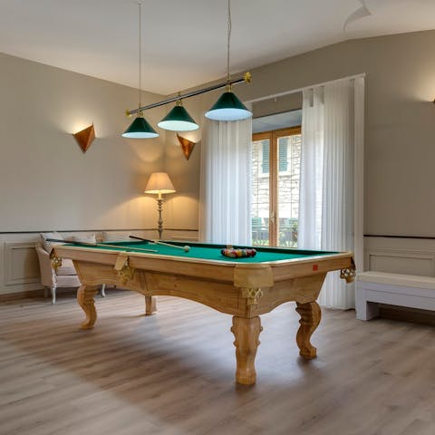 Get competitive playing pool during cocktail hour