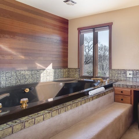 The earthy finishes of the master bathroom