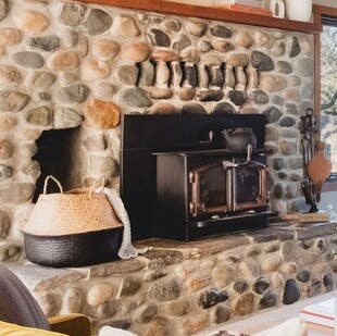 Reminisce by this rubble masonry fireplace