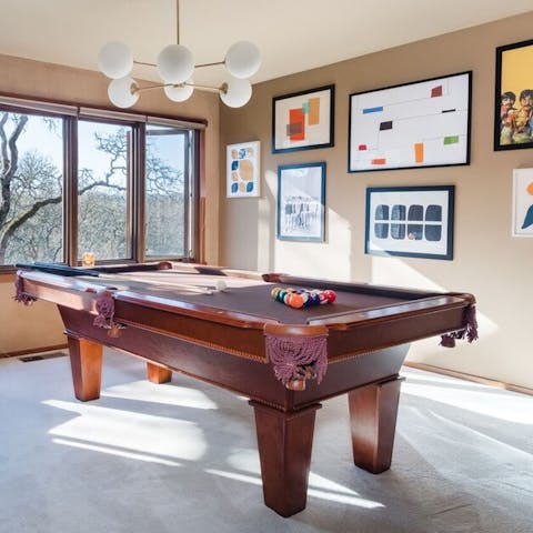 Enjoy after dinner drinks by the billiards table