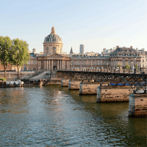 Cross the famous Pont des Arts over the Seine