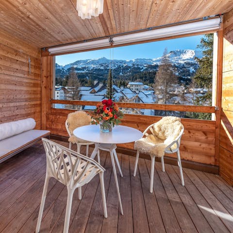 Admire the mountain views over a glass of champagne on the terrace
