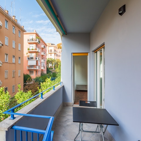 Enjoy a chilled glass of Italian white wine on the balcony