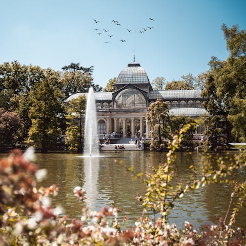 Stroll around the lake at nearby El Retiro Park